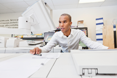 Man Printing a Book